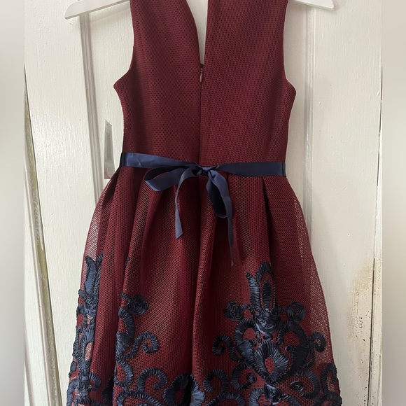 Burgundy and navy blue V neck dress with bow and navy blue design at the bottom - Picture 3 of 3